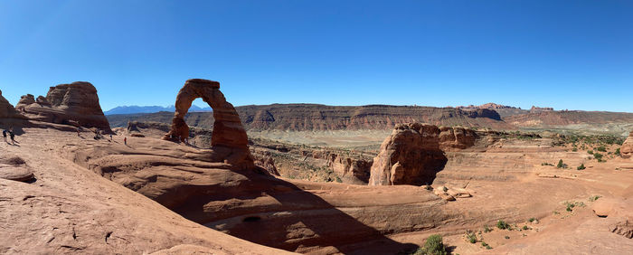 View of rock formations against blue sky