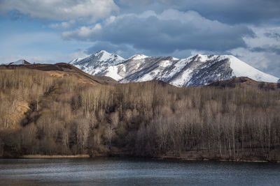 Lake in the mountains in winter. galanchozh. scenic view of snowcapped mountains against sky