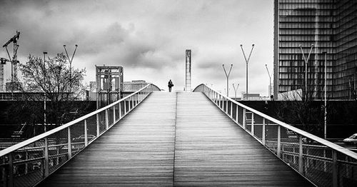 People walking on footbridge