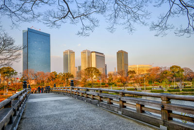 View of city buildings against clear sky