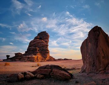 Rock formations on landscape against sky