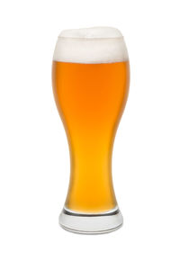 Close-up of beer glass against white background