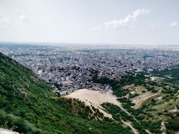 High angle view of buildings in city against sky