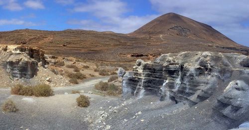 Panoramic view of rock formations against sky