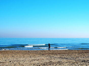 Scenic view of beach against clear sky