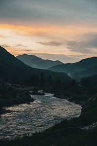 Scenic view of mountains against sky during sunset