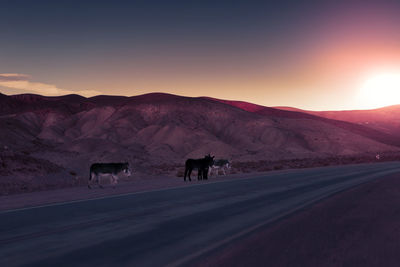 Scenic view of mountains against sky during sunset