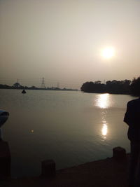 Scenic view of sea against clear sky during sunset