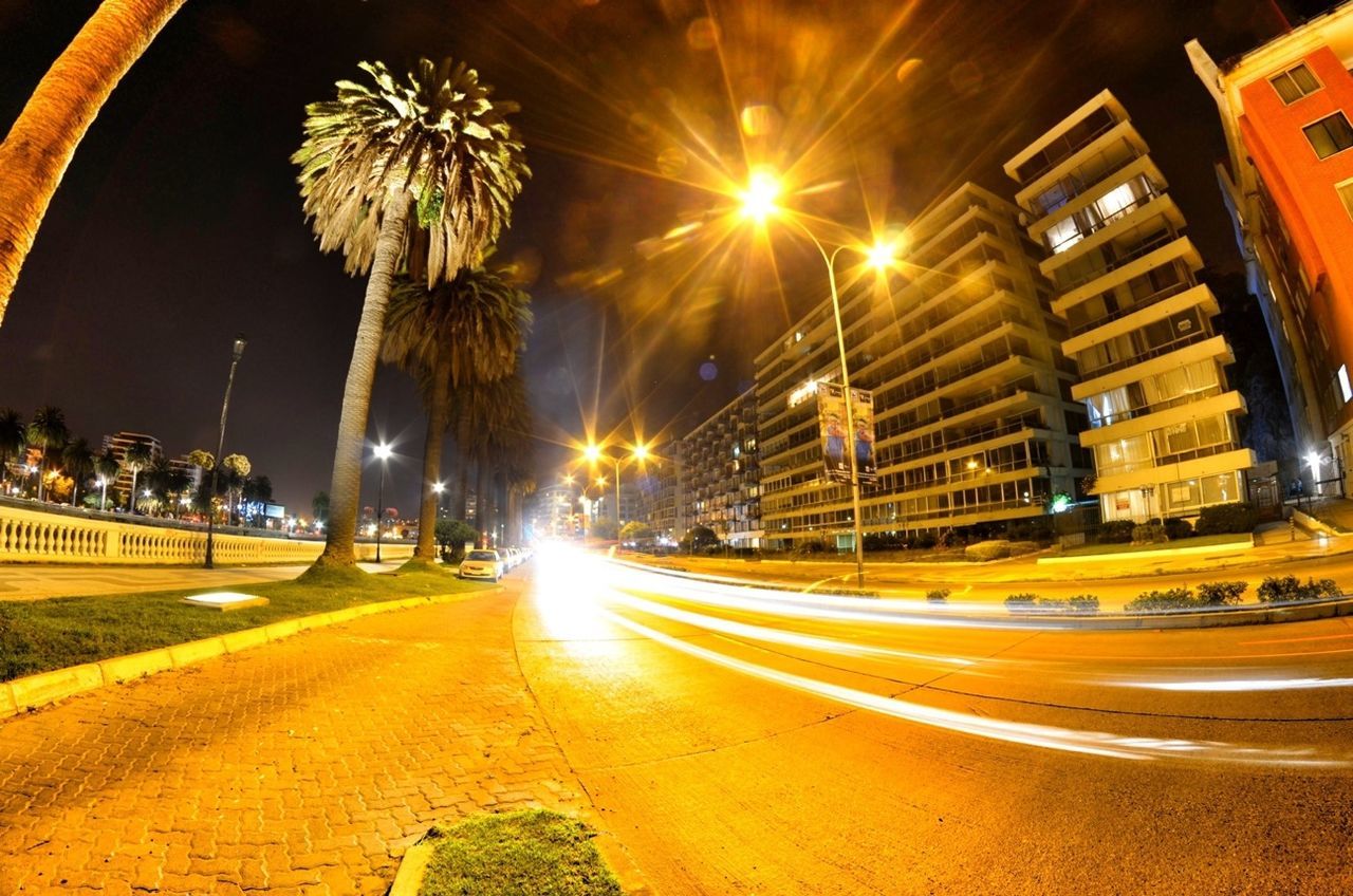 illuminated, night, architecture, building exterior, built structure, city, long exposure, transportation, street, street light, light trail, road, motion, lighting equipment, sky, car, the way forward, blurred motion, city street, city life