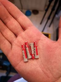 Close-up of hand on red finger