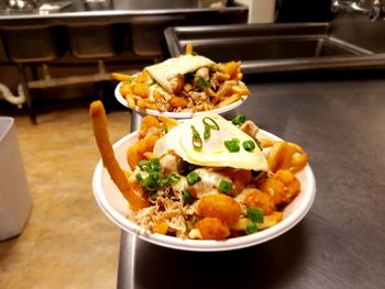 High angle view of chopped vegetables in bowl on table