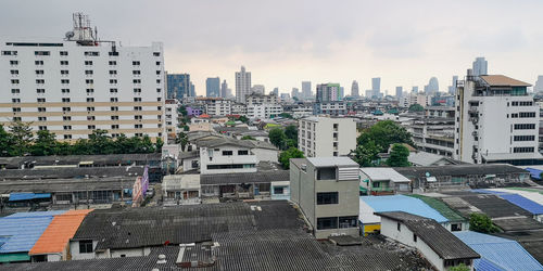 High angle view of buildings in city against sky