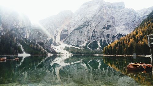 Panoramic shot of lake by mountains against sky