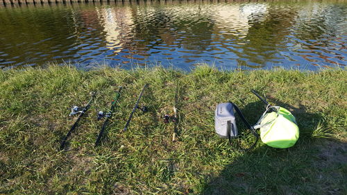 High angle view of fishing rod by lake