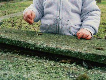 Close-up of kids hands working