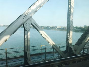 View of bridge over river in city