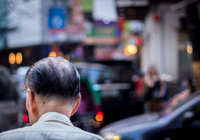 Rear view of man in city street