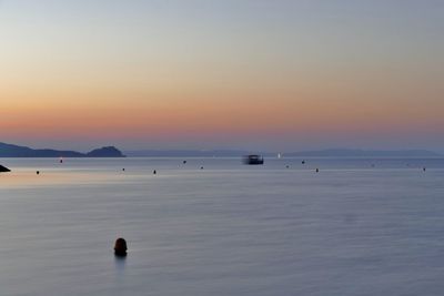 Scenic view of sea against sky at sunset