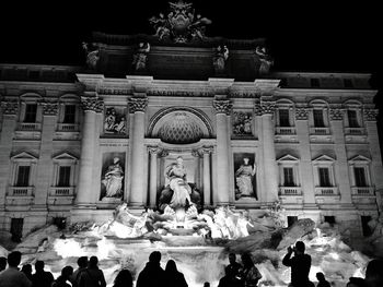 Low angle view of statue in front of building