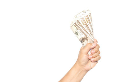 Human hand holding ring against white background