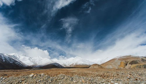 Scenic view of snowcapped mountains against sky