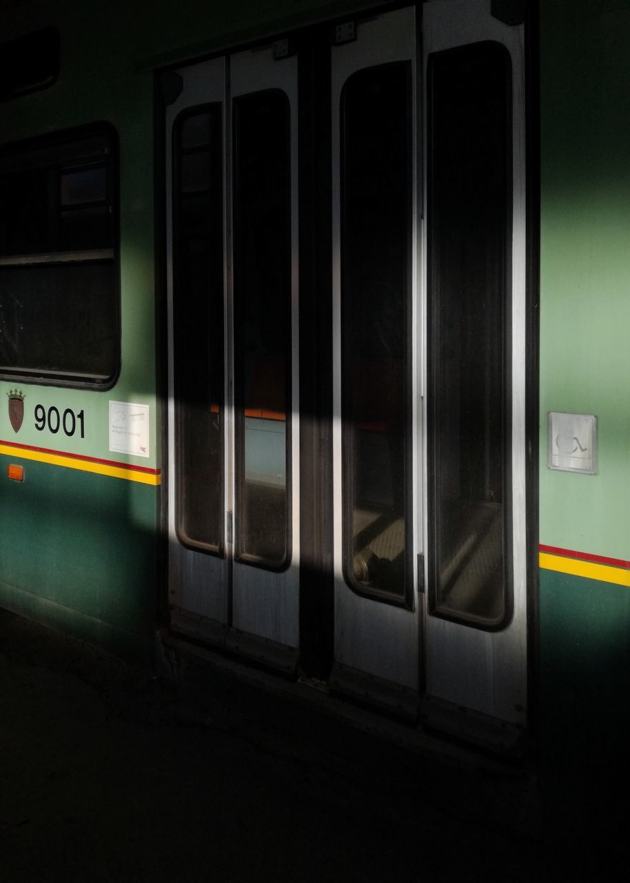 TRAIN IN RAILROAD STATION PLATFORM