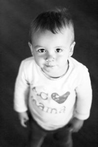 High angle portrait of boy standing at home