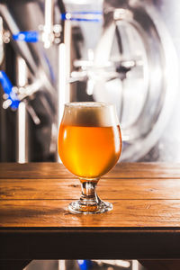 Close-up of beer glass on table