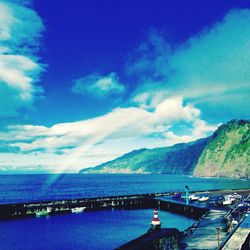 Scenic view of sea against cloudy sky