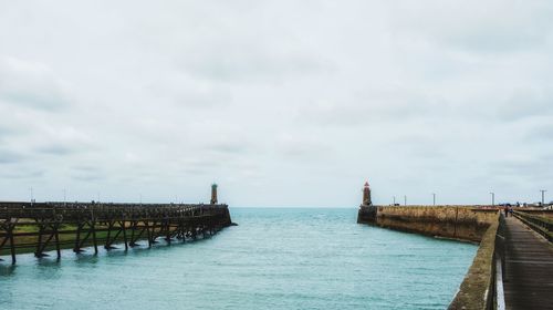 Pier over sea against sky