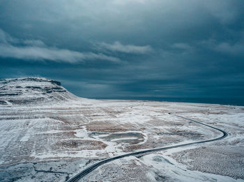 Scenic view of snowcapped landscape against sky