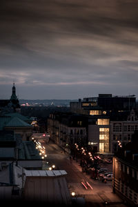 High angle view of city lit up at night