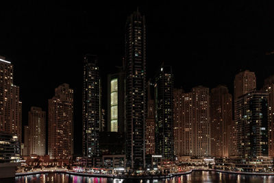 Illuminated buildings in city at night