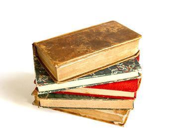 High angle view of books against white background