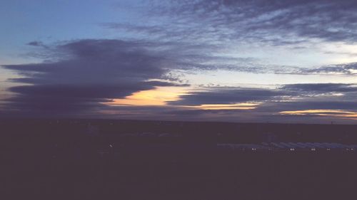 Scenic view of landscape against cloudy sky