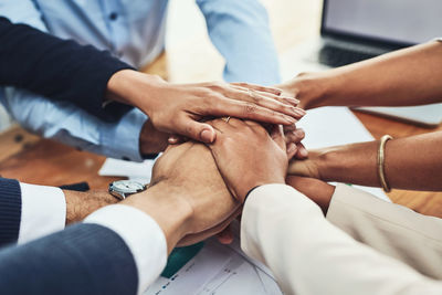 Midsection of business people shaking hands