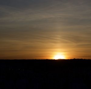 Scenic view of silhouette landscape against sky during sunset