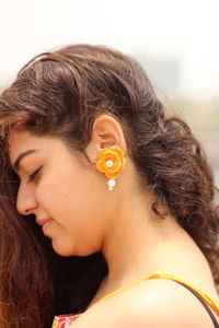 Close-up portrait of woman with eyes closed