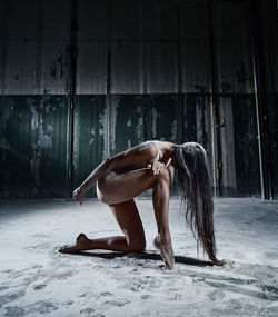 Woman powder dancing in abandoned house