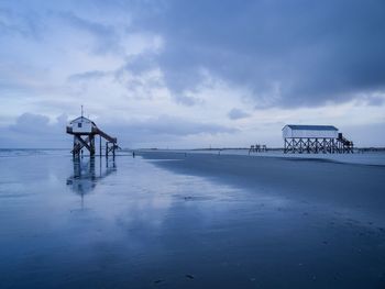 Scenic view of sea against sky during winter