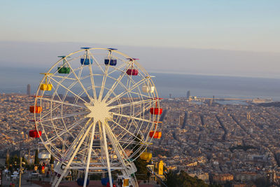 Ferris wheel on top of the city, at tibidabo, barcelona