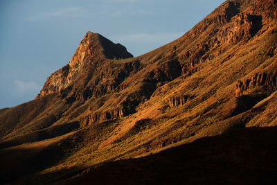 Low angle view of mountains against sky at canary islands