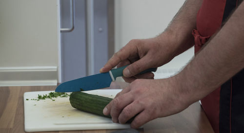 Midsection of man working on table