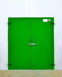 Green closed door of building