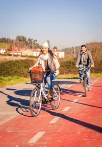 Portrait of a smiling woman riding bicycle
