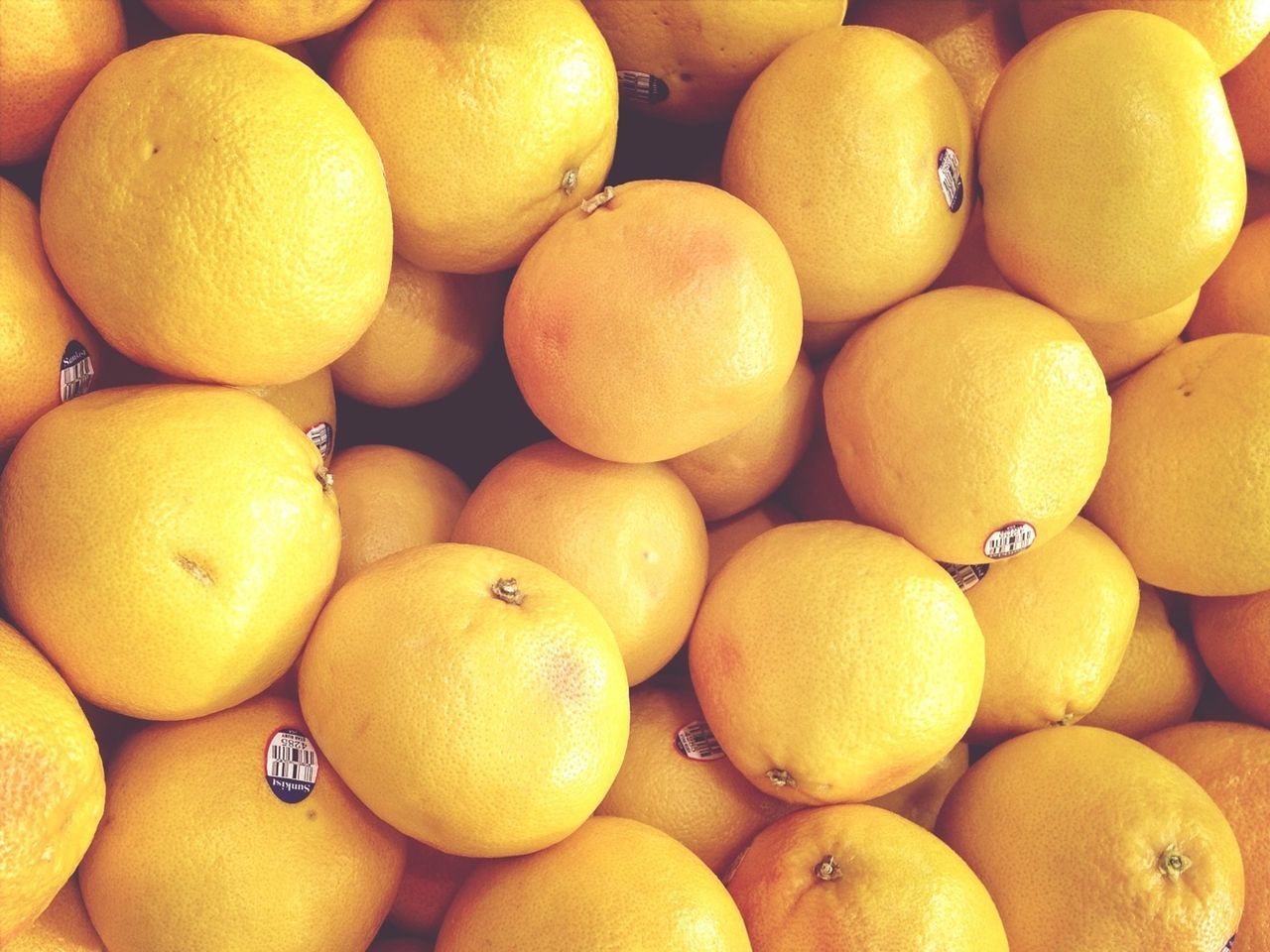 food and drink, food, freshness, full frame, healthy eating, yellow, backgrounds, fruit, large group of objects, abundance, orange - fruit, orange color, indoors, for sale, still life, close-up, citrus fruit, retail, market, no people