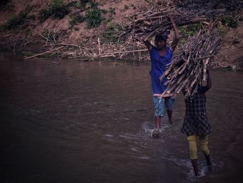 Full length of man standing in water