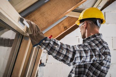 Carpenter working with wood at workshop