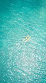 Aerial view of man in boat at sea