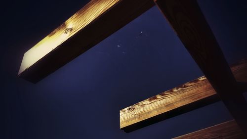 Low angle view of illuminated lamp against sky